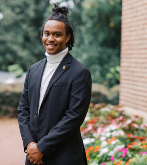 Austin Dixon standing in front of the Administration Building