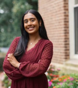 Lehkan Patel standing in front of the Administration Building