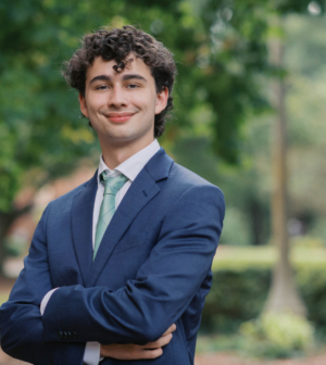 Jackson Schoeborn standing in front of the Administration Building