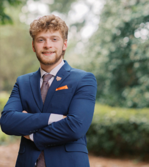 Matthew Campbell standing in front of the Administration Building