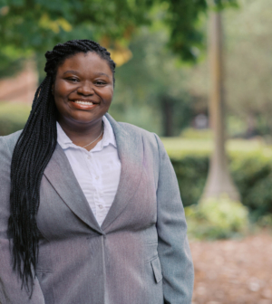 Amareaya Bell standing in front of the Administration Building