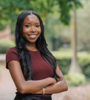 Hannah Parker standing in front of the Administration Building