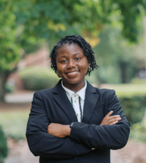 Hannah Nichols standing in front of the Administration Building