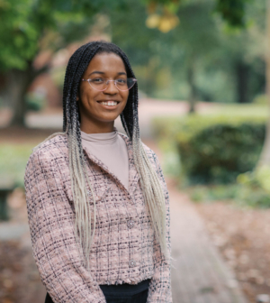 Brielle Mclean standing in front of the Administration Building