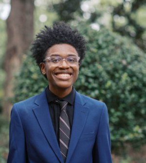 Harrison Carr standing in front of the Administration Building
