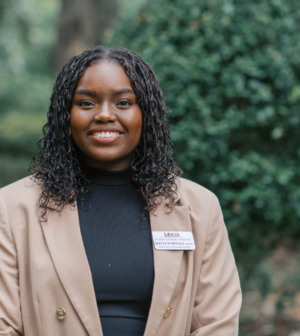 Olivia Woodall standing in front of the Administration Building