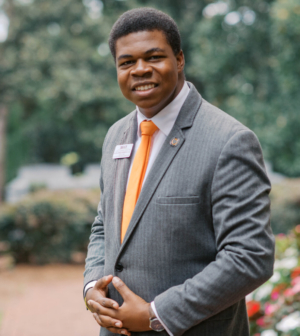 Alexander Marshall standing in front of the Administration Building