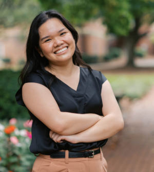 Cindy Cao standing in front of the Administration Building