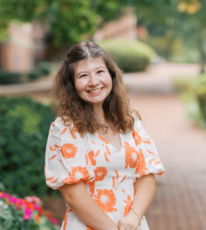 Callie Lowery standing in front of the Administration Building