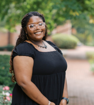 Amber Thomas standing in front of the Administration Building