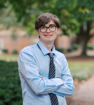 Paul Frayer standing in front of the Administration Building