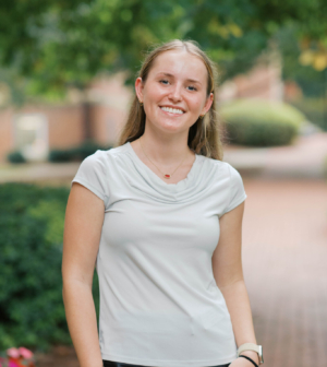 Rachel Garver standing in front of the Administration Building