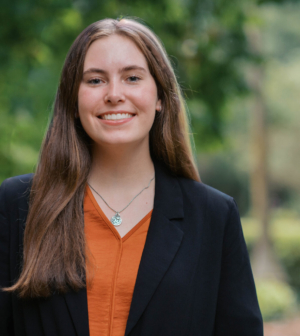 Renee Jansen Van Vuuren standing in front of the Administration Building