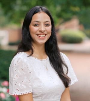 Riddhi Maheshwari standing in front of the Administration Building